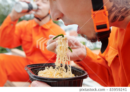Construction Worker Eating Ramen Soup Construction Worker Eating Ramen Soup 83959241