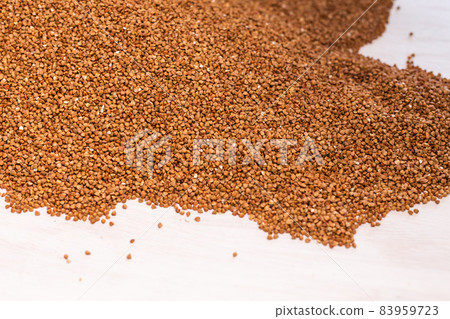 Fresh buckwheat background texture. Cereals and organic food concept Fresh buckwheat background texture. Cereals and organic food concept 83959723