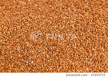Fresh buckwheat background texture. Cereals and organic food concept Fresh buckwheat background texture. Cereals and organic food concept 83959725