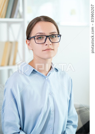 Smart business woman. Professional career. Intelligent people. Portrait of confident relaxed female life coach in eyeglasses at light home office interior. 83960207