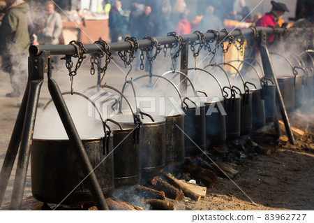 Food in bowlers on bonfire, cooking outdoor in a traditional style 83962727