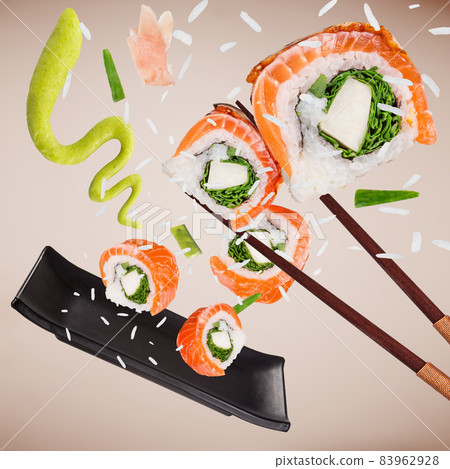 Pieces of delicious japanese sushi frozen in the air. 83962928