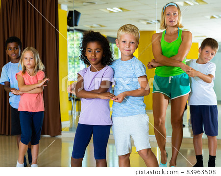 Little boys and girls dancing pair dance in the ballet studio Little boys and girls dancing pair dance in the ballet studio 83963508