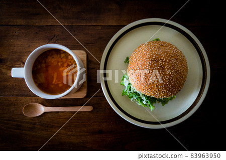 Home Cafe Minestrone Soup and Wooden Spoon and Burger Vintage Antique Wooden Table Home Cafe Minestrone Soup and Wooden Spoon and Burger Vintage Antique Wooden Table 83963950