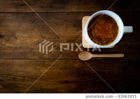 Home Cafe Minestrone Soup, Wooden Spoon and Vintage Antique Brown Table with Wood Grain Home Cafe Minestrone Soup, Wooden Spoon and Vintage Antique Brown Table with Wood Grain 83963955