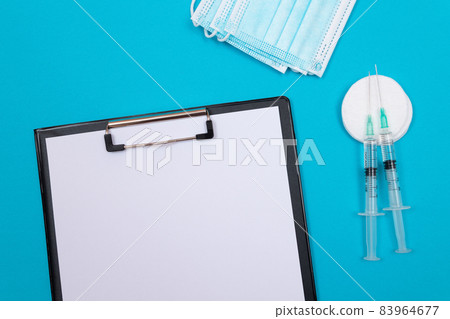 Vaccination or Revaccination Concept - Two Medical Syringe on Blue Table 83964677