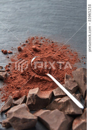 Chocolate chunks and cocoa powder Chocolate chunks and cocoa powder 83965258