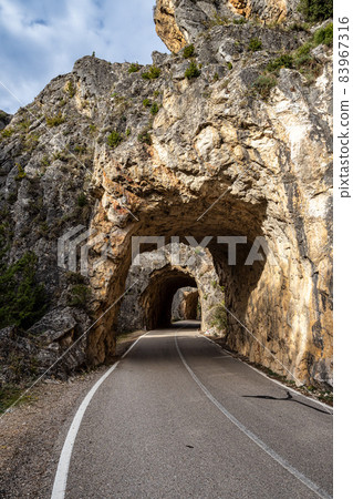 Tunnel hole at Serrania de Cuenca in Spain near Cuenca and Fuertescusa. Door to hell Tunnel hole at Serrania de Cuenca in Spain near Cuenca and Fuertescusa. Door to hell 83967316