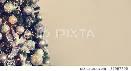 Silver Christmas balls on a fir branch. 83967706