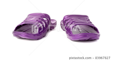 pair of cheap durable purple rubber slippers isolated on white background. 83967827