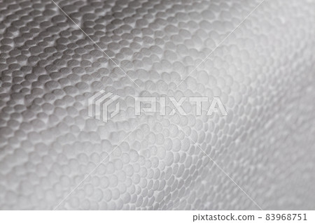 Simple close-up bumpy background of white polystyrene foam or styrofoam, white on white backdrop with selective focus and partial blur. Simple close-up bumpy background of white polystyrene foam or styrofoam, white on white backdrop with selective focus and partial blur. 83968751