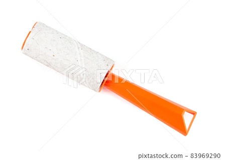 used orange single-use sticky cleaning roller with some hair and fur isolated on white background 83969290