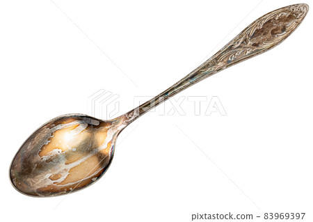 old cupronickel spoon with visible oxidation layer isolated on white background old cupronickel spoon with visible oxidation layer isolated on white background 83969397