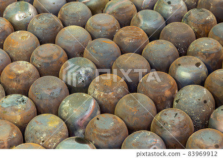 abstract full frame industrial background of rusted steel dome round workpieces after draw process abstract full frame industrial background of rusted steel dome round workpieces after draw process 83969912