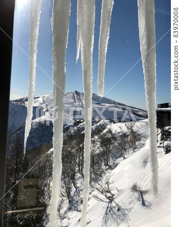 Icicles in the snowy mountains 83970008