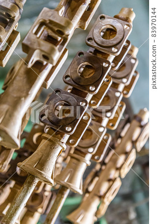 industrial lost wax models on sprue waiting for shell making, close-up with selective focus 83970144