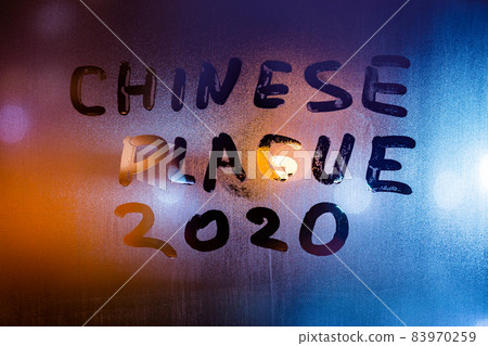 the words chinese plague 2020 handwritten on sweat window glass surface at night the words chinese plague 2020 handwritten on sweat window glass surface at night 83970259