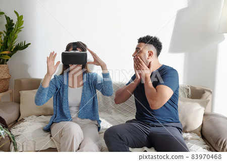 Man Looking at Playing Girlfriend Man Looking at Playing Girlfriend 83970468