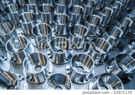 a batch of shiny metal cnc aerospace parts production - close-up with selective focus for industrial background a batch of shiny metal cnc aerospace parts production - close-up with selective focus for industrial background 83971179