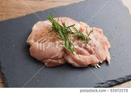 Chicken thighs spiced with herbs 83972578