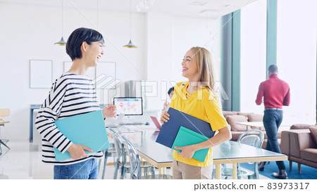 Female group having conversations in a global office Global business 83973317