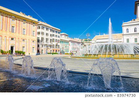Piazza Raffaele De Ferrari square with fountain, Palazzo Ducale Doge's Palace and Teatro Carlo Felice theatre building in historical centre 83974730