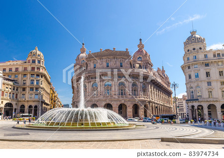 Piazza Raffaele De Ferrari square with fountain and Palazzo della Nuova Borsa Palace barocco style building in historical centre of old city Genoa 83974734