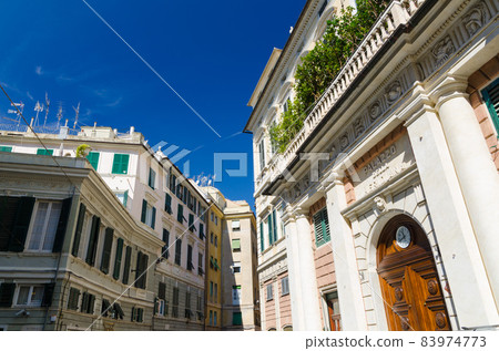 Facade of palace Palazzo Grimaldi della Meridiana classic style building with watch on doors on Piazza della Meridiana square Facade of palace Palazzo Grimaldi della Meridiana classic style building with watch on doors on Piazza della Meridiana square 83974773