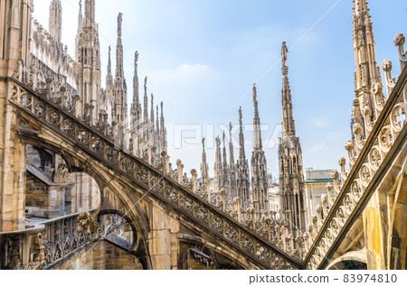White marble statues on roof of Duomo di Milano Cathedral, Italy White marble statues on roof of Duomo di Milano Cathedral, Italy 83974810