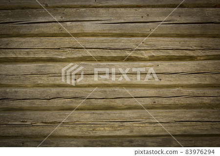 Wooden logs of an old house. Close-up. Weathered natural gray wood texture. Background. Horizontal photo Wooden logs of an old house. Close-up. Weathered natural gray wood texture. Background. Horizontal photo 83976294