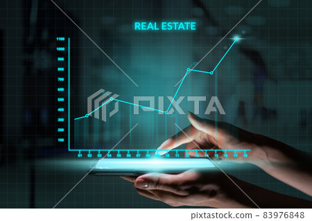 Business investment concept. Person holding smartphone with Abstract graph real estate growth 83976848