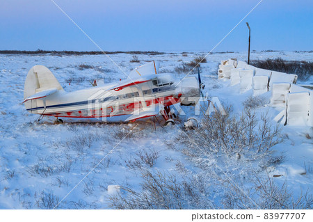 Russian biplane aircraft near the old Northern airfield in the tundra. Suburb of Anadyr, Chukotka, Russia. Russian biplane aircraft near the old Northern airfield in the tundra. Suburb of Anadyr, Chukotka, Russia. 83977707