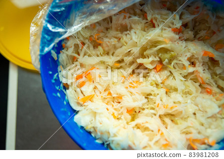 Sauerkraut in a plastic container, top view 83981208