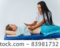 Young woman having massage in spa salon. Wellness, healing and relaxation concept. 83981732