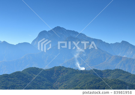 Smoke signal rose from Nakayama Fort on a sunny day in Hakushu-cho, Hokuto City. 83981958
