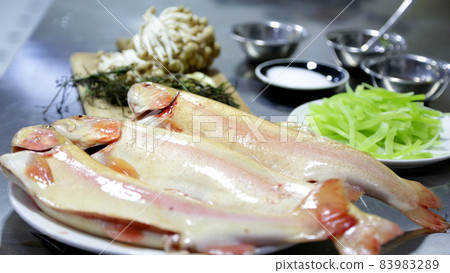 Fish preparation in the kitchen of the restaurant, salmon and vegetables 83983289