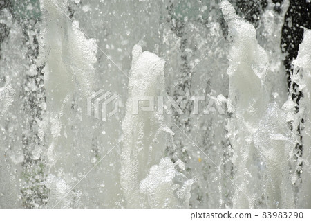 Splash of water gush of water of a fountain abstract background 83983290