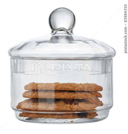 Glass storage jar for cookies isolated on white 83984350