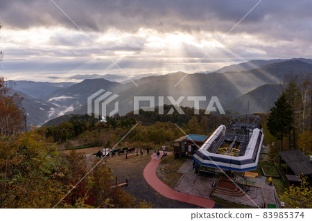 Achi Village, Nagano Prefecture Heavens Sonohara Observatory with people watching the sea of clouds in the morning and oblique light from the clouds Achi Village, Nagano Prefecture Heavens Sonohara Observatory with people watching the sea of clouds in the morning and oblique light from the clouds 83985374