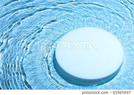 Empty white circle podium on transparent blue water background with copy space Empty white circle podium on transparent blue water background with copy space 83985697