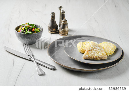 Semifinished squid cutlet in breading Semifinished squid cutlet in breading 83986589