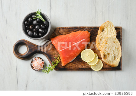 Top view of piece of fresh salmon tail fillet 83986593