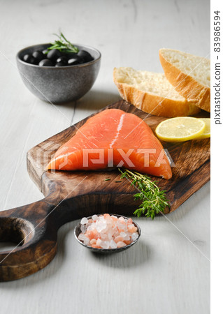 Piece of fresh salmon tail fillet Piece of fresh salmon tail fillet 83986594