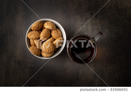 Amaretti biscuits. Sweet italian almond cookies and tea 83986691