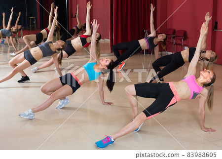 Happy females are training on the floor Happy females are training on the floor 83988605