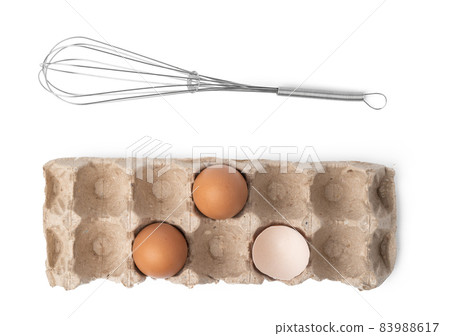 Fresh eggs with whisk isolated on white background Fresh eggs with whisk isolated on white background 83988617