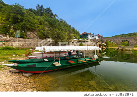 Old Bridge in Rijeka Crnojevica River near Skadar Lake - Montenegro 83988971