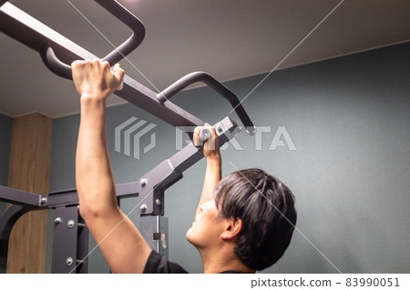 Men training in the gym (pull-ups) 83990051