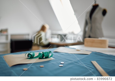 Maesuring tape on the table, workshop interior 83990872