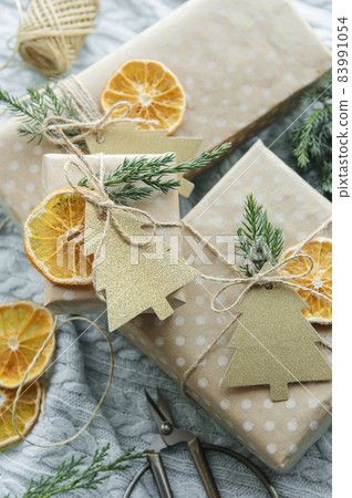 Christmas  decorative homemade gift boxes wrapped in brown kraft paper 83991054